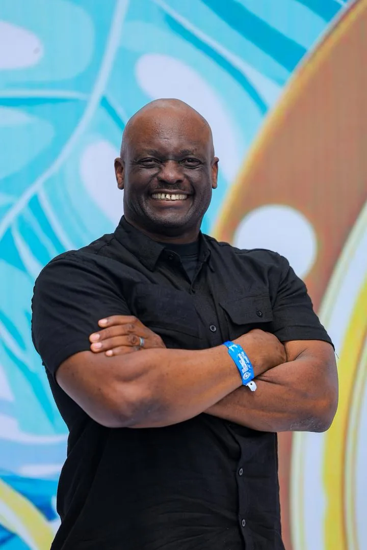 Coach Bob Ssebugwawo at a community wellness event